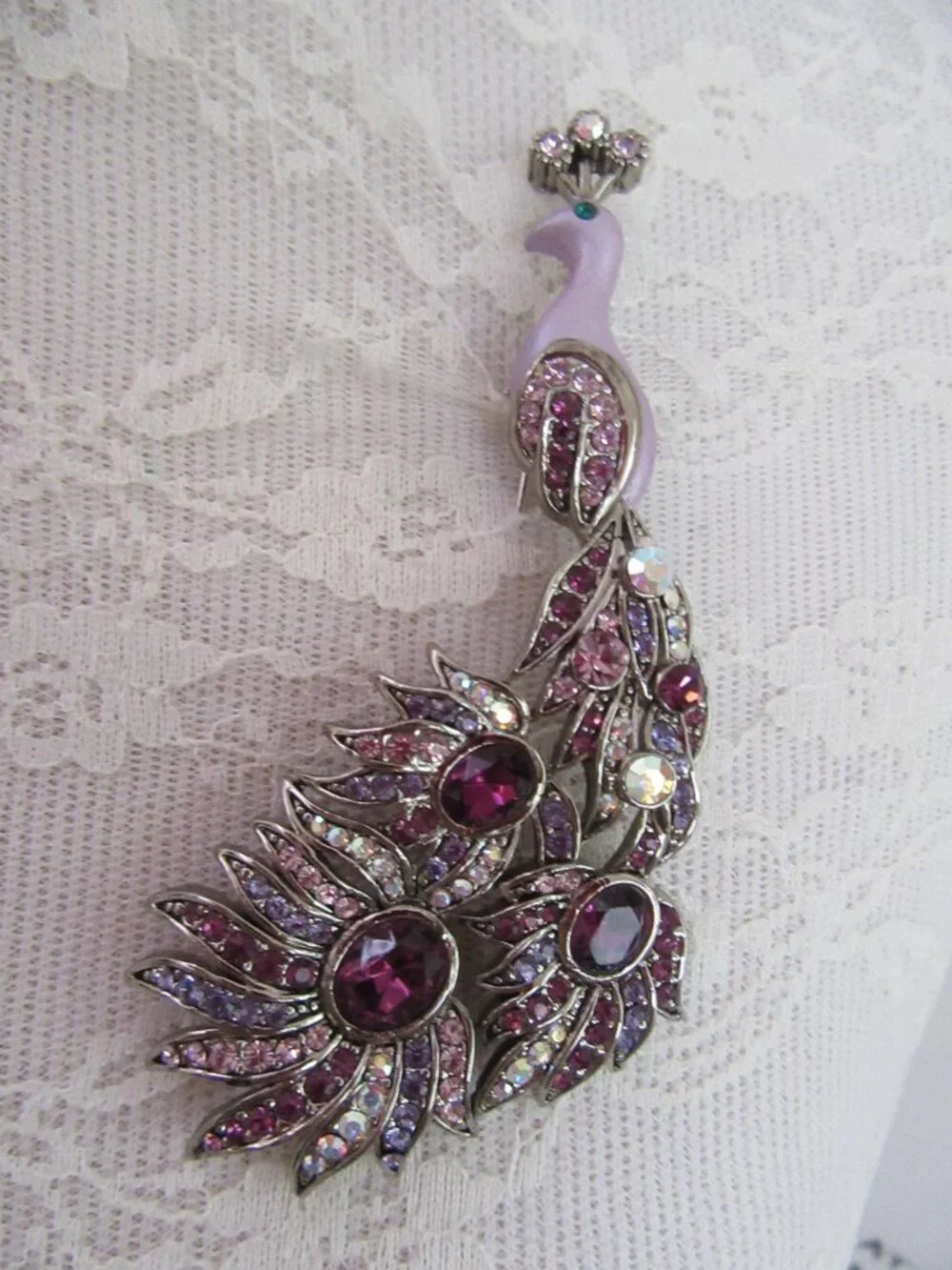 Peacock brooch with purple and aurora borealis rhinestones in silver setting